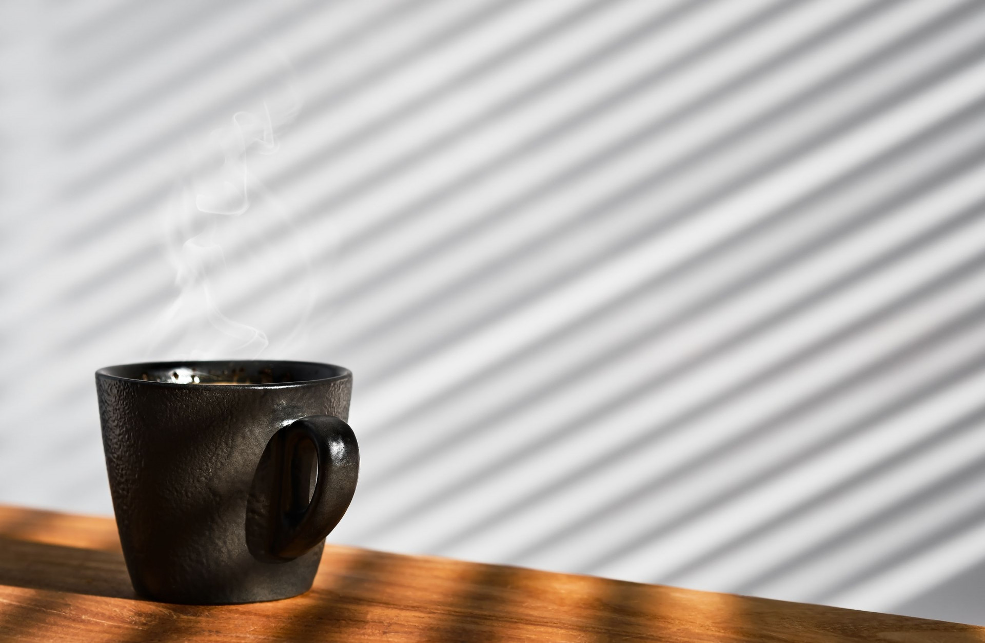 Cup Of Freshly Made Espresso Coffee In A Cup On A Wooden Table, Steam Rises Over The Ristretto. Coff