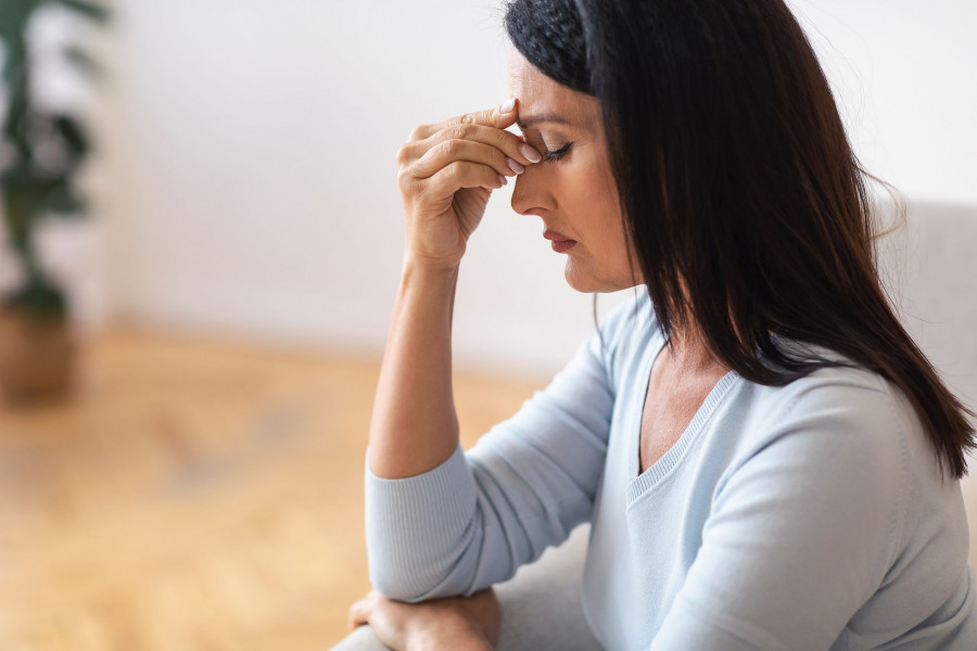 Exhaustion And Weakness. Side View Portrait Of Fatigued Upset Mature Lady Massaging Her Nose Bridge,