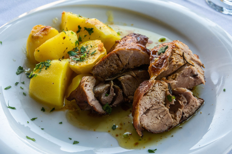 Roasted Lamb Flavored With Thyme And Rosemary, Served With Potatoes