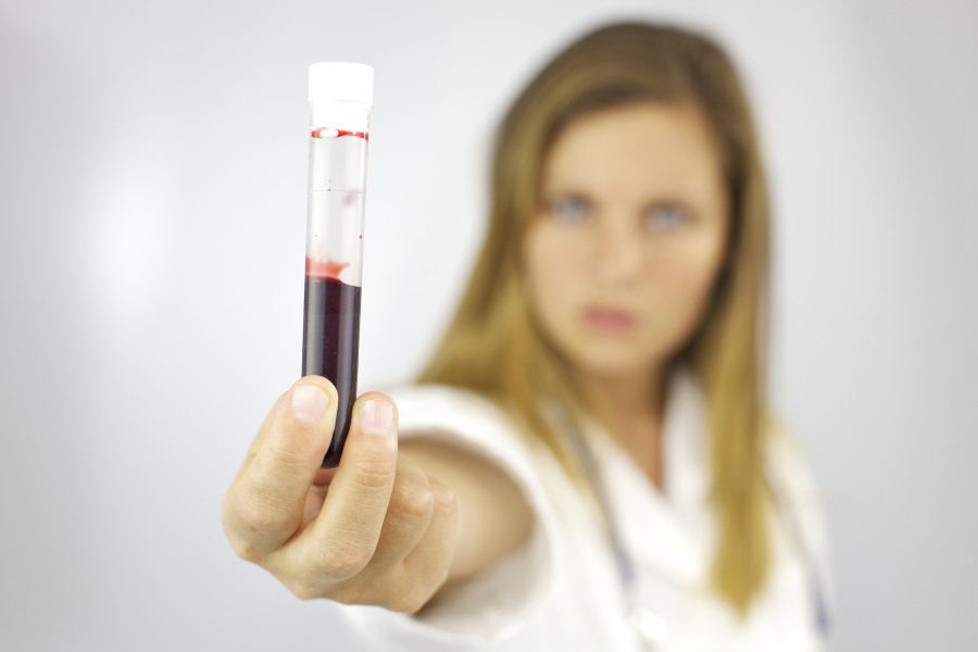 Doctor With Blood Sample In Hand