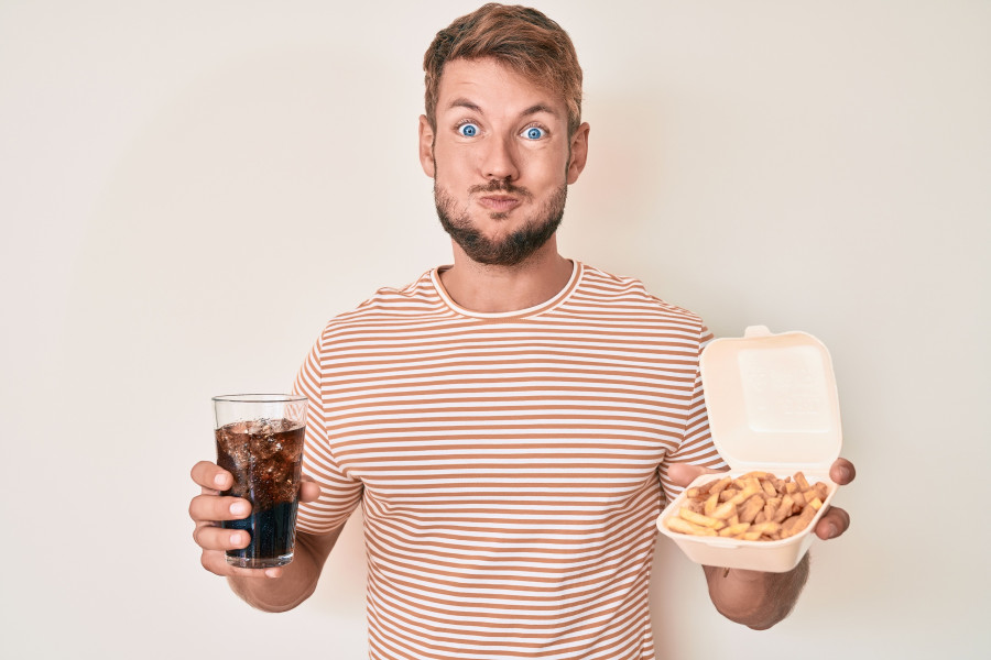 man eating fast food