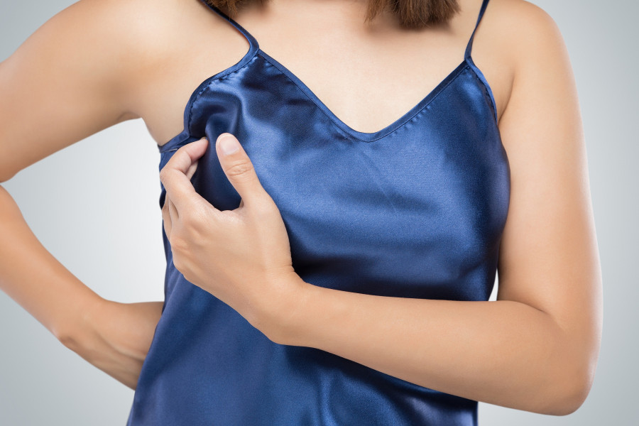 Breast cancer self check Woman holding her breast