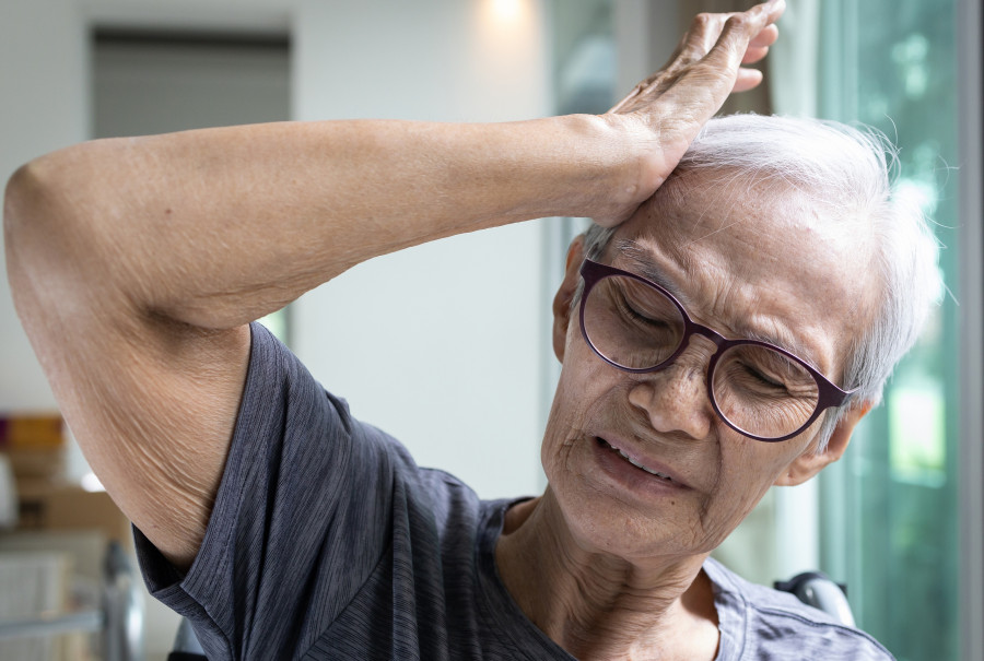 Senior Woman Suffering From Severe Headache