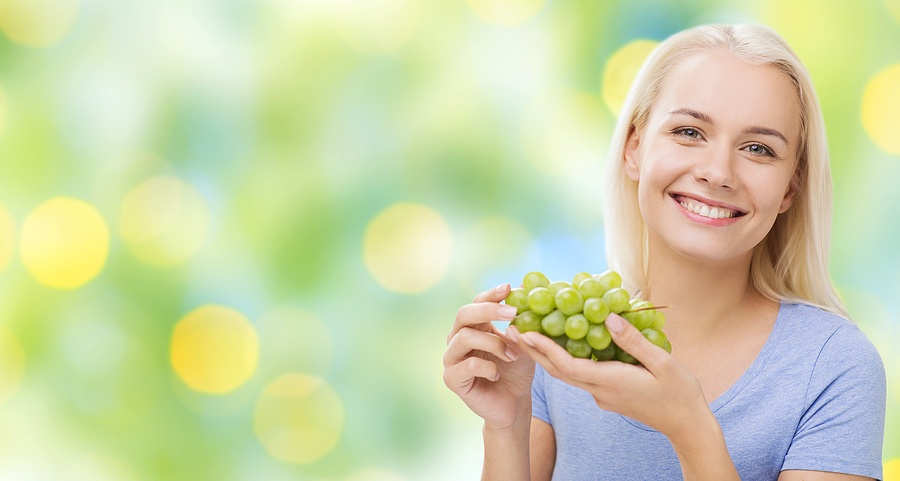 woman eating grapes