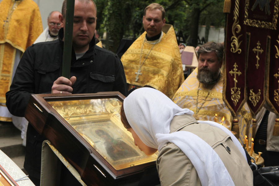 Orthodox believer kisses the miracle-working icon of the Virgin Mary
