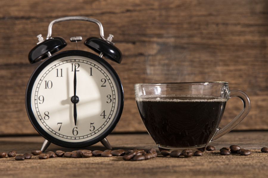 A Cup Of Coffee And Coffee Bean With Clock