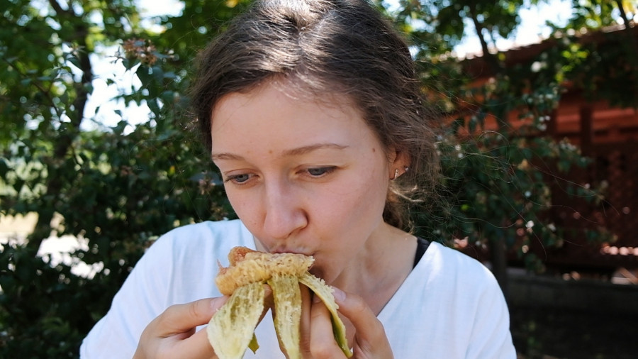 Woman Biting And Eating Ripe Fig