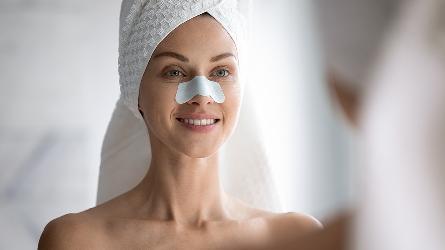 Woman Apply Nose Strip Cleansing Pores blackheads