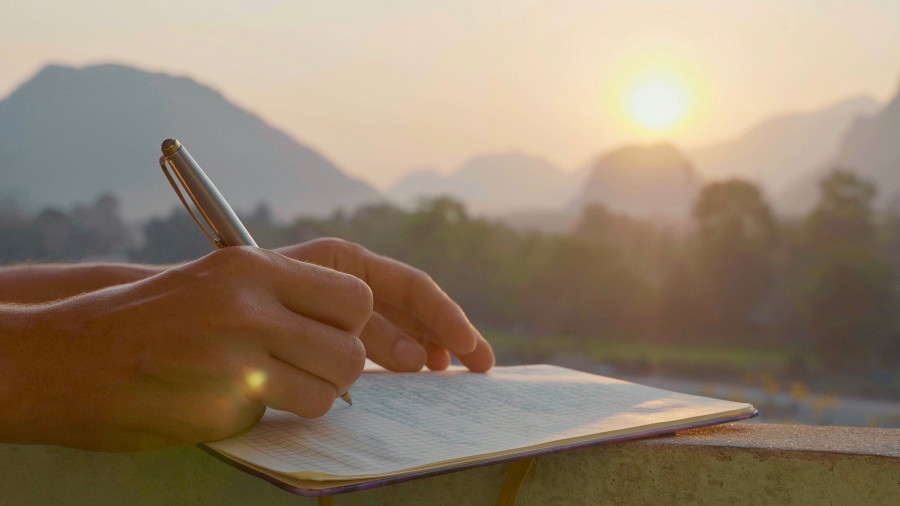 Woman Writing In Diary