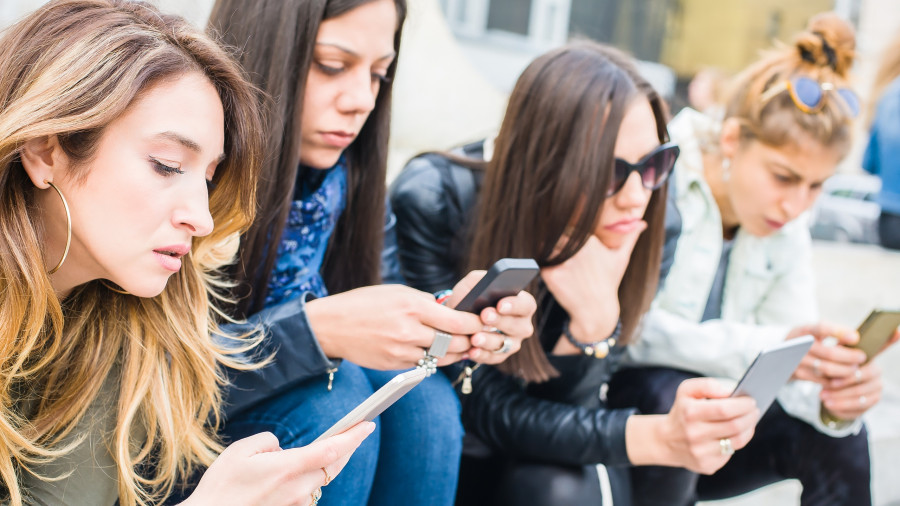 Group Of Girls With Smartphones