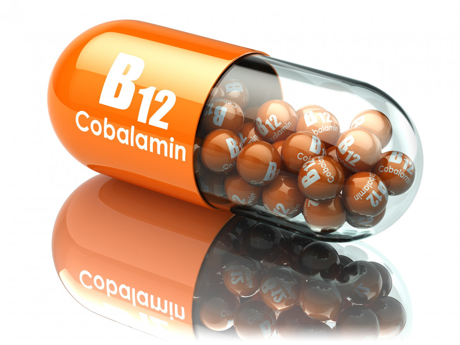 Vitamin B12 capsule. Pill with cobalamin. Dietary supplements