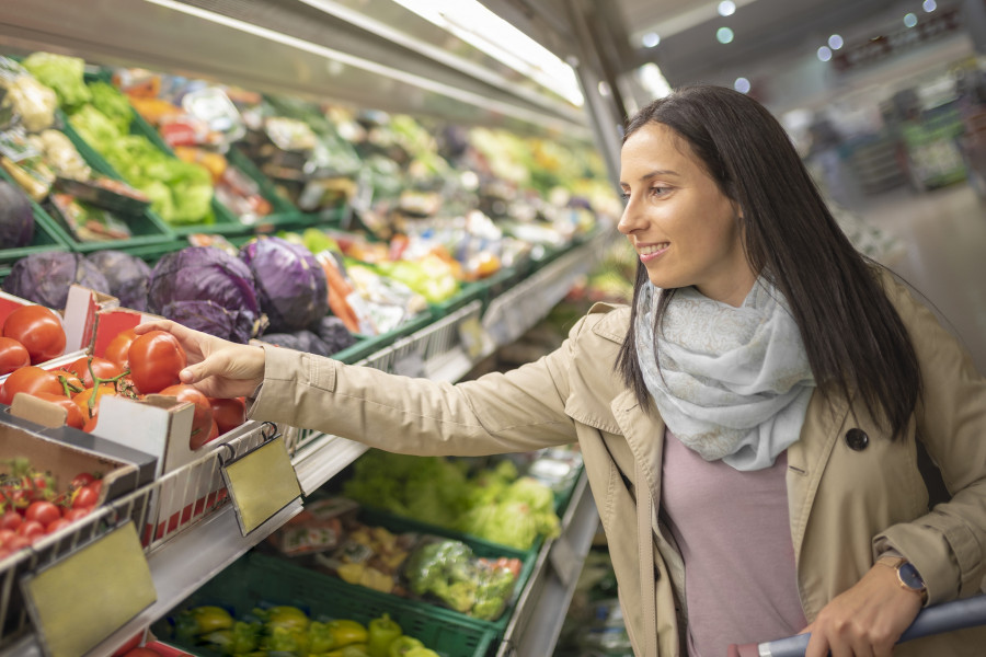 woman buying healthy food supermarket fruits vegetables