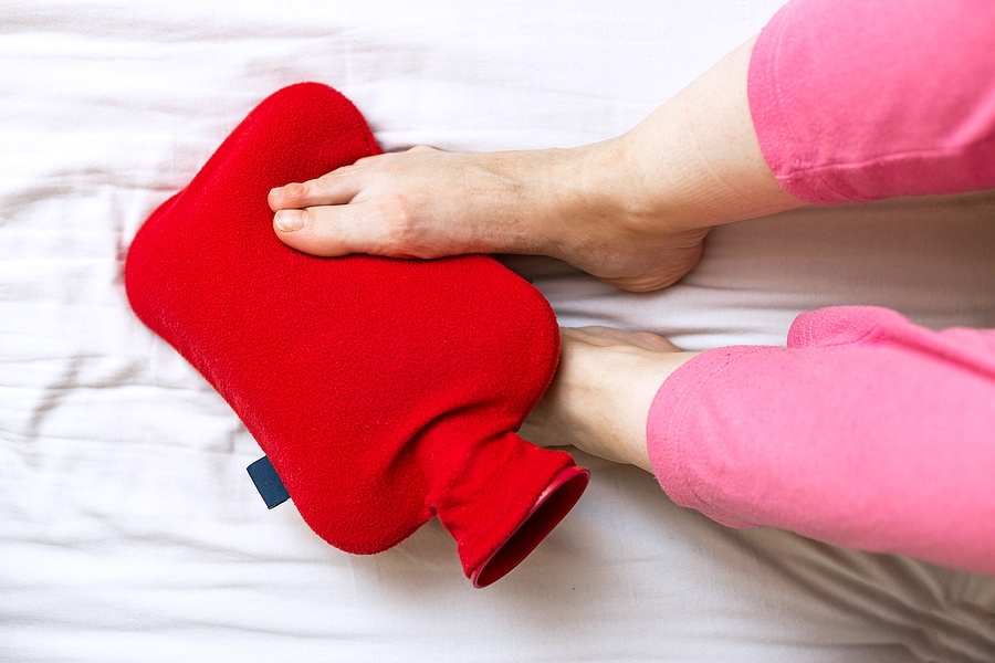 Cold Feet In Bed On A Red Hot Water Bottle