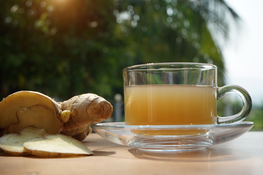 Ginger Tea In Glass Cup And Ginger Root
