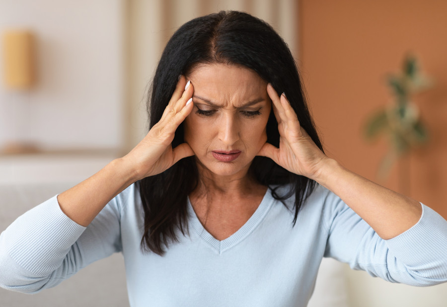 Tired Woman Suffering From Headache