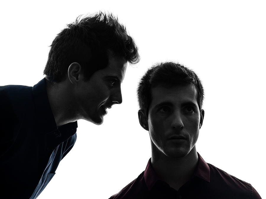 two young men hearing voices