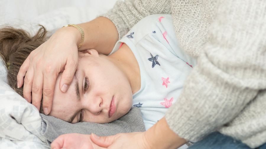 A Child Being Cared For During An Epileptic Seizure