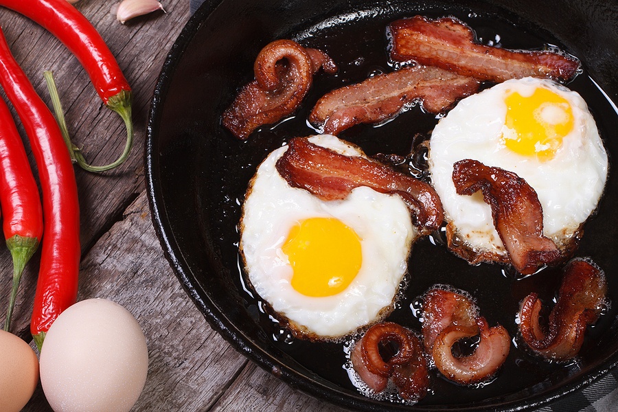 Fried Eggs With Bacon In A Frying Pan