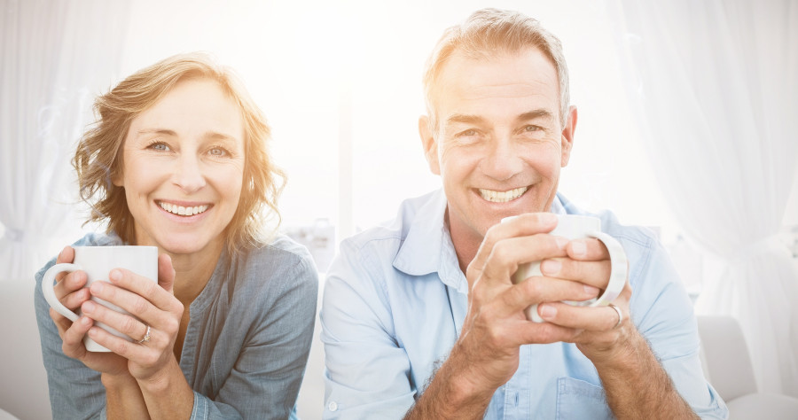 couple sitting on the couch having coffee