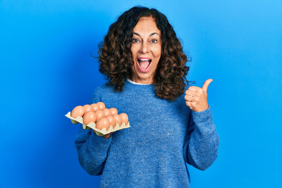 woman holding tray of fresh eggs