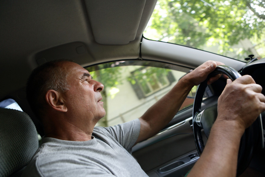 Senior Man Driving A Car