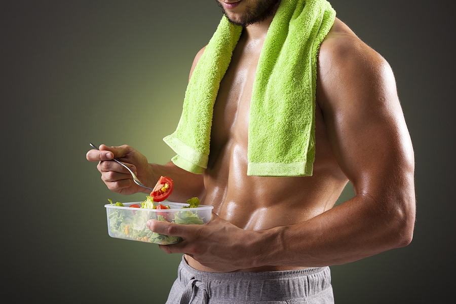 man holding a bowl of fresh salad
