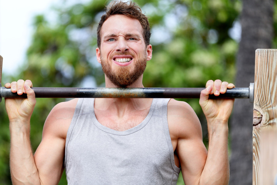 man exercising chin-ups workout