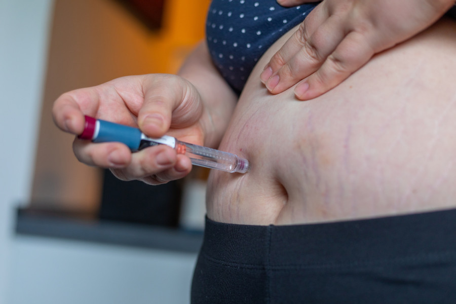 Overweight Woman Applying Diabetes Medicine Injection