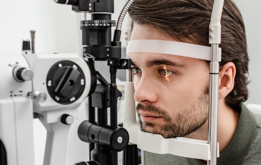 Man Getting An Eye Exam At Ophthalmology Clinic