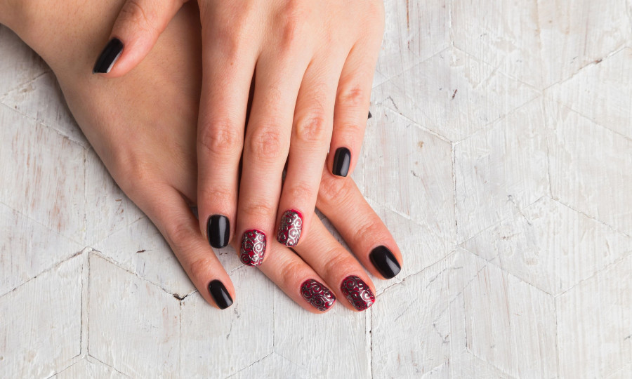 Beautiful female hands with nails painted nails