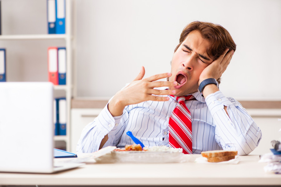 Man having meal at work during break