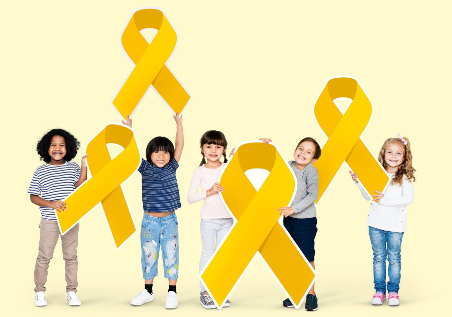 Kids holding gold ribbons supporting childhood cancer awareness