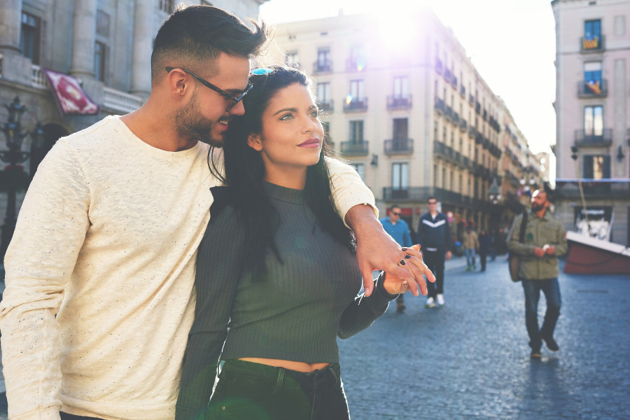 couple walking in city center of Barcelona